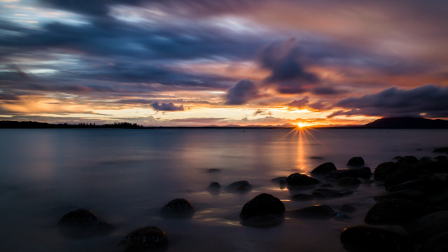 Sunset water rocks mountain clouds free wallpaper - medium preview image