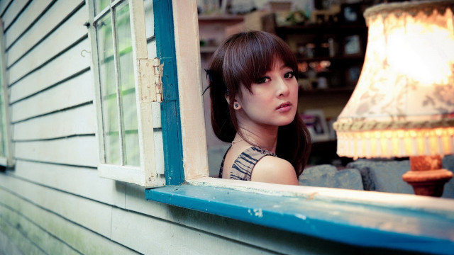 Woman window lamp building portrait free wallpaper - medium preview image