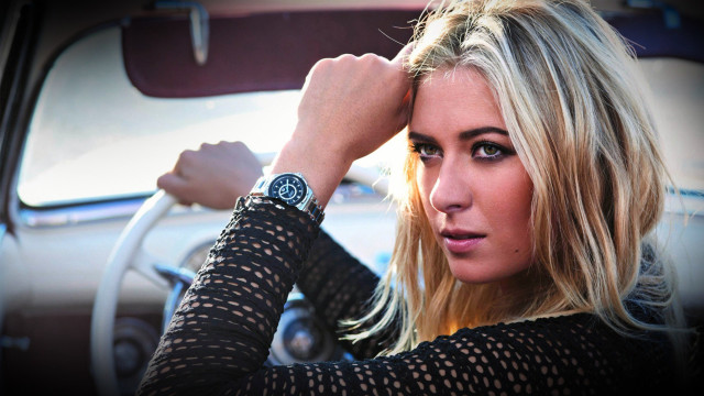 Woman sitting car serious blonde #2 free wallpaper - medium preview image
