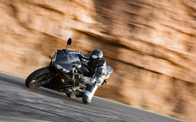 Man motorcycle curvy road rockwall free wallpaper - medium preview image