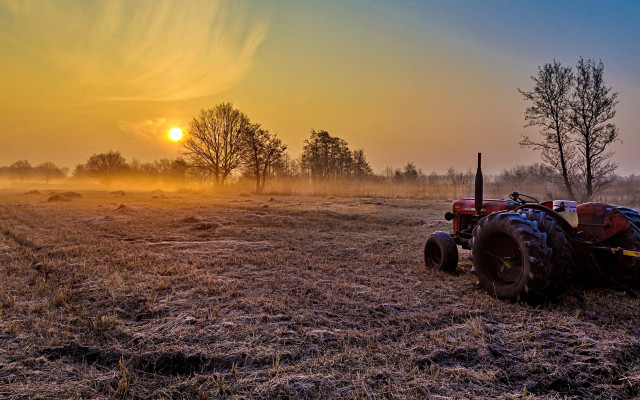 Tractor field sunset fog cityscape free wallpaper - medium preview image