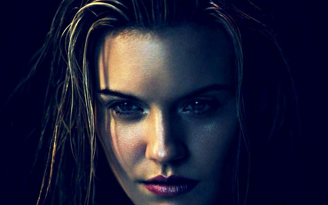 Woman black shirt serious face free wallpaper - medium preview image