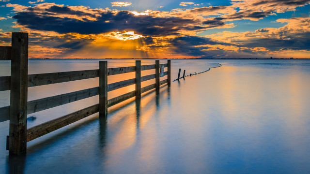 Wooden fence beach cloudy sky free wallpaper - medium preview image