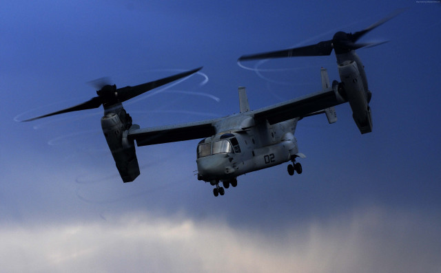 Military plane cloudy sky landing #2 free wallpaper - medium preview image