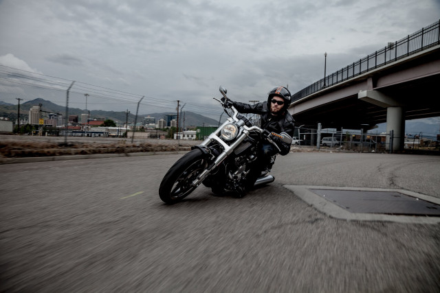 Man motorcycle bridge tilt shift free wallpaper - medium preview image