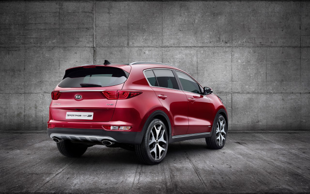Red car parked cement wall free wallpaper - medium preview image