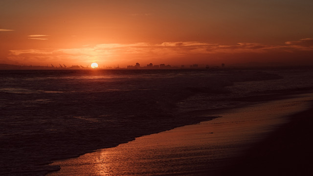 Sunset ocean city beach person free wallpaper - medium preview image