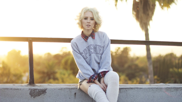 Woman sitting ledge blonde sweater free wallpaper - medium preview image
