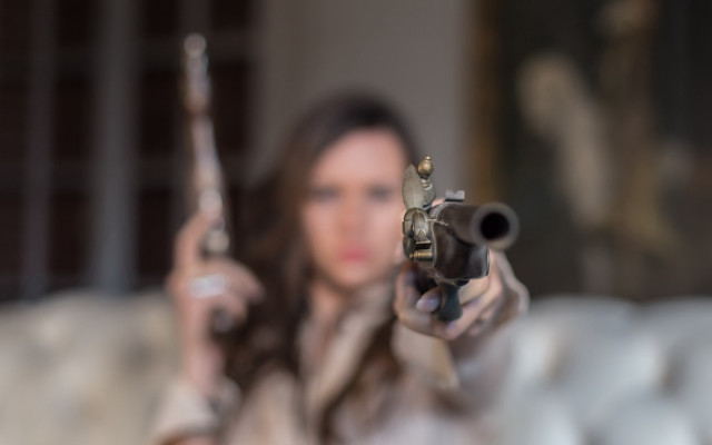 Woman gun blurry background pov free wallpaper - medium preview image
