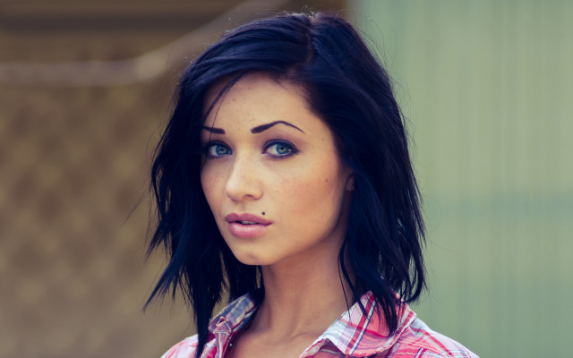 Serious woman fake face photorealistic free wallpaper - medium preview image