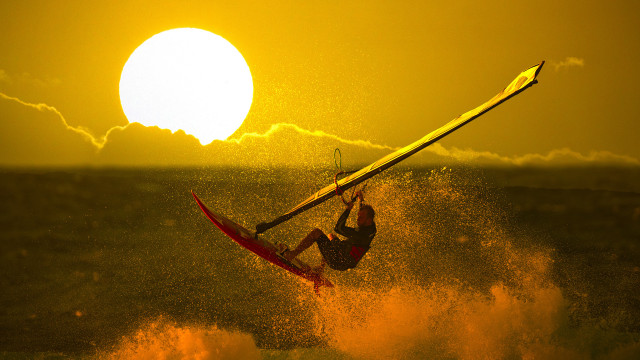 Surfing silhouette dusk ocean mountain free wallpaper - medium preview image