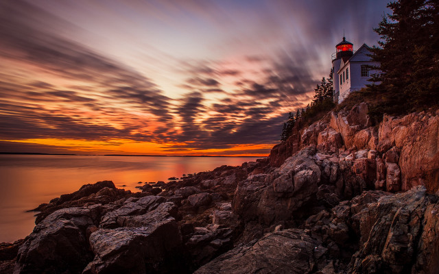 Lighthouse rocky cliff sunset clouds free wallpaper - medium preview image
