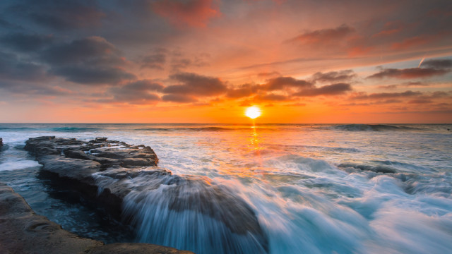 Sunset ocean waves rocks person free wallpaper - medium preview image