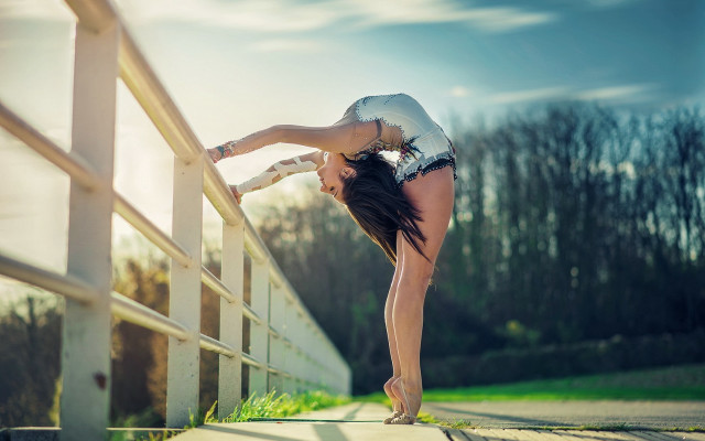 Woman bridge stretching sunlight dynamic free wallpaper - medium preview image