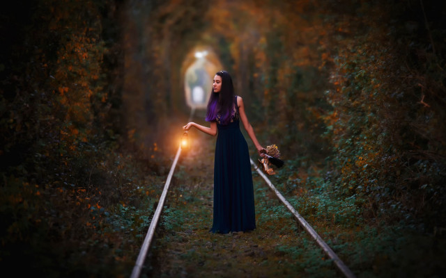 Woman holding light traintrack woods free wallpaper - medium preview image