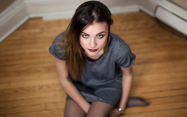 Woman sitting crossed pony tail free wallpaper - medium preview image