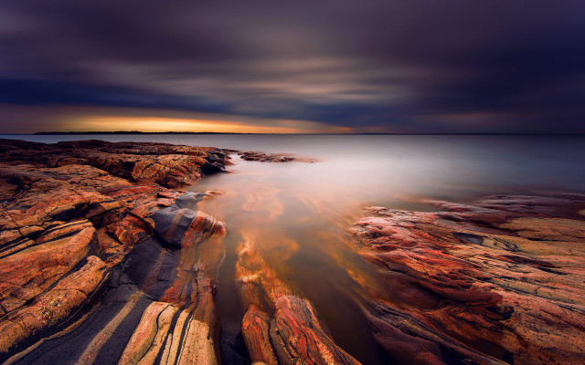 Mystical rocky shore city light free wallpaper - medium preview image