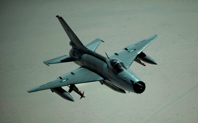 Fighter jet person hanging standing free wallpaper - medium preview image