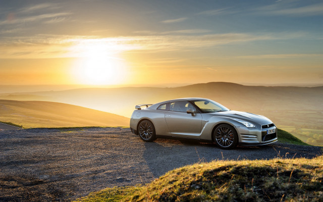 Silver sports car hill sunset free wallpaper - medium preview image