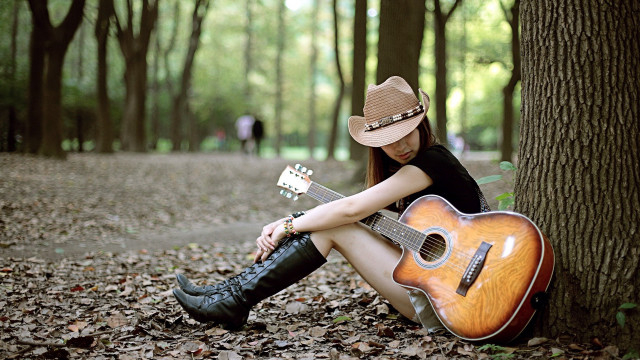 Woman sitting guitar cowboy hat free wallpaper - medium preview image