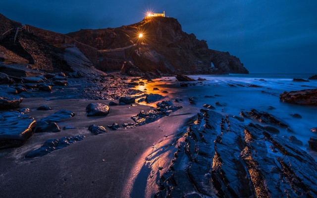 Lighthouse rocky cliff night shining free wallpaper - medium preview image