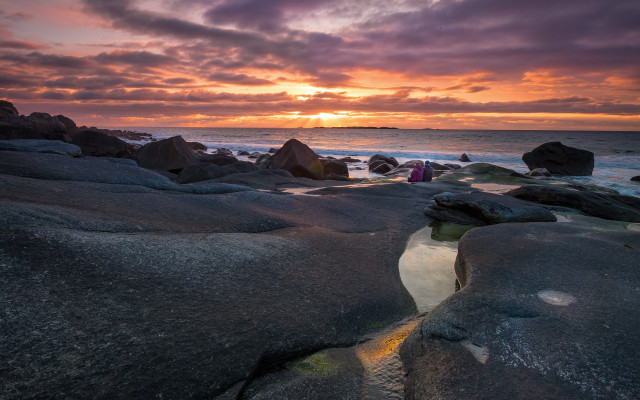 Sunset rocky beach people cliffs free wallpaper - medium preview image