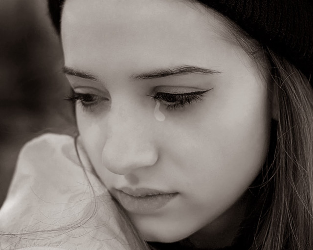 Sad woman crying cellphone tears free wallpaper - medium preview image