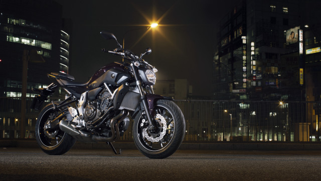Motorcycle city night streetlight buildings free wallpaper - medium preview image