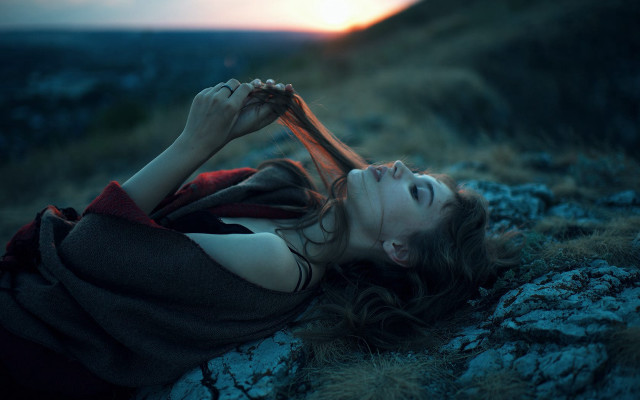 Rocky hillside woman blurry depth free wallpaper - medium preview image