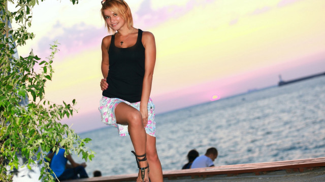 Woman skateboard beach sunset blurry free wallpaper - medium preview image