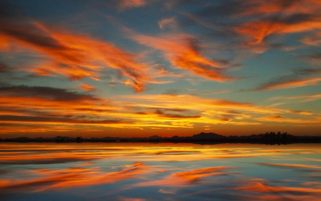 Sunset clouds reflecting water boat free wallpaper - medium preview image
