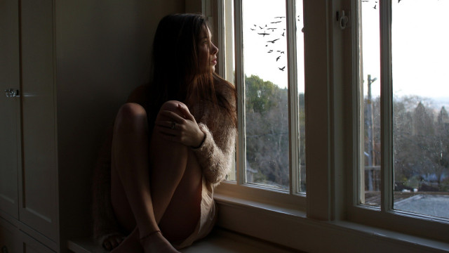 Woman sitting window outside trees free wallpaper - medium preview image