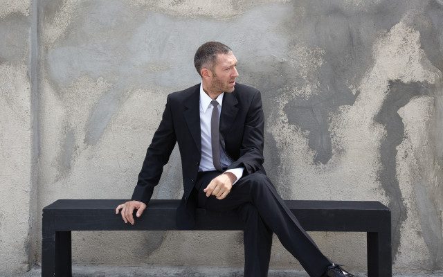 Man suit bench hand hip free wallpaper - medium preview image