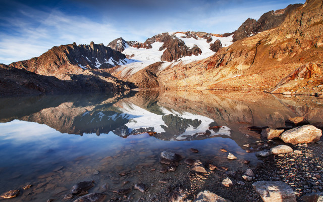 Mountain lake rocks snow clouds free wallpaper - medium preview image