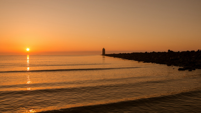 Sunset ocean boat lighthouse horizon free wallpaper - medium preview image