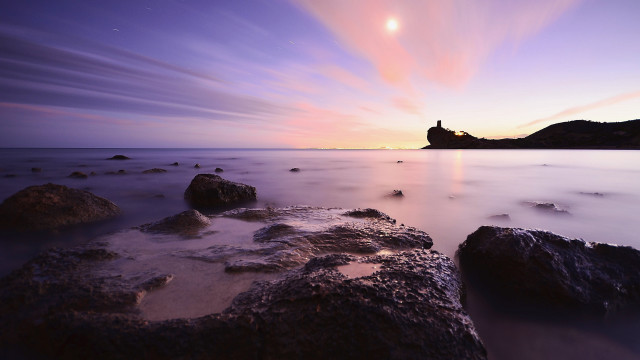 Sunset lighthouse rocky beach purple free wallpaper - medium preview image
