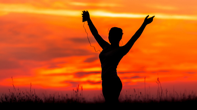 Woman field arms up backlighting free wallpaper - medium preview image