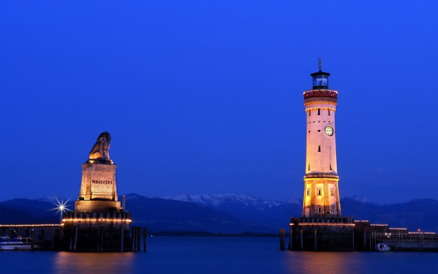 Lighthouse night mountains water clock free wallpaper - medium preview image
