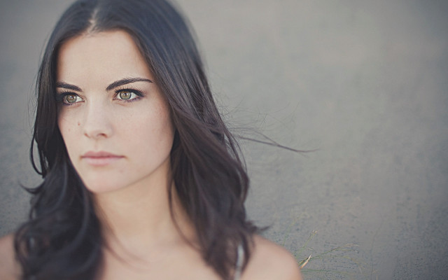 Woman serious portrait blackhair browneyes free wallpaper - medium preview image