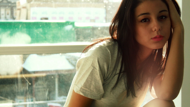Woman window natural light cityscape free wallpaper - medium preview image