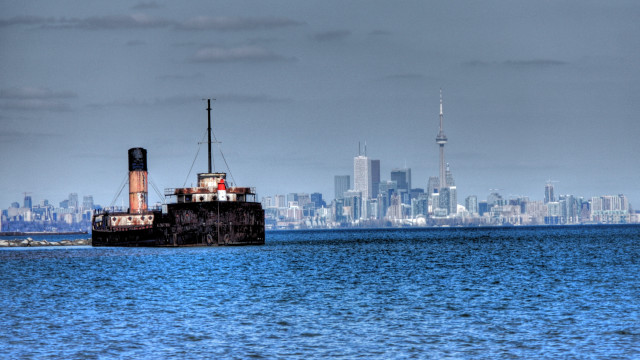 Boat cityscape cloudy water skyscraper free wallpaper - medium preview image