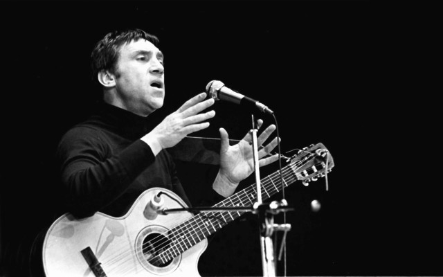 Man holding guitar standing microphone free wallpaper - medium preview image