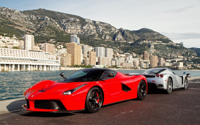 Red sports cars cityscape mountains free wallpaper - medium preview image