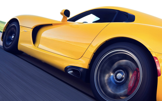 Yellow sports car driving blurry free wallpaper - medium preview image