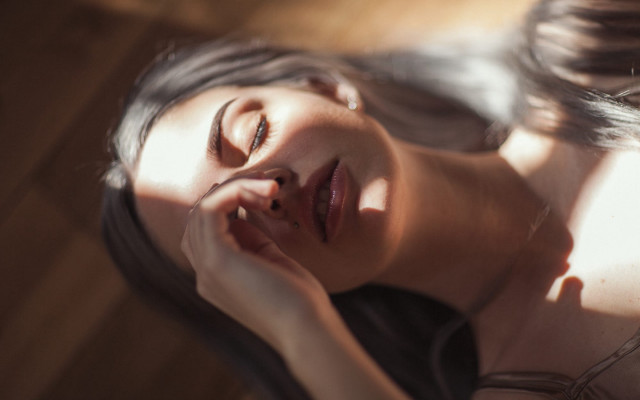 Woman laying down closed eyes free wallpaper - medium preview image