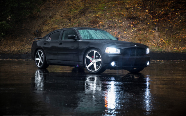 Black car wet road hillside free wallpaper - medium preview image