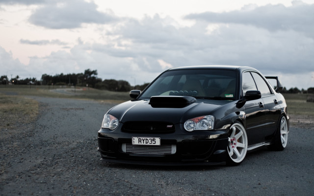 Black car gravel road field free wallpaper - medium preview image
