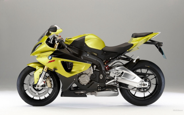 Yellow motorcycle gray wall digital free wallpaper - medium preview image
