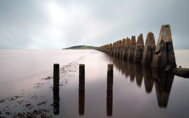 Wooden posts beach ocean sky free wallpaper - medium preview image