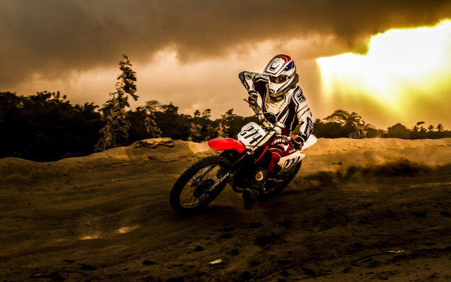 Dirtbike riding cloudy sky trees free wallpaper - medium preview image